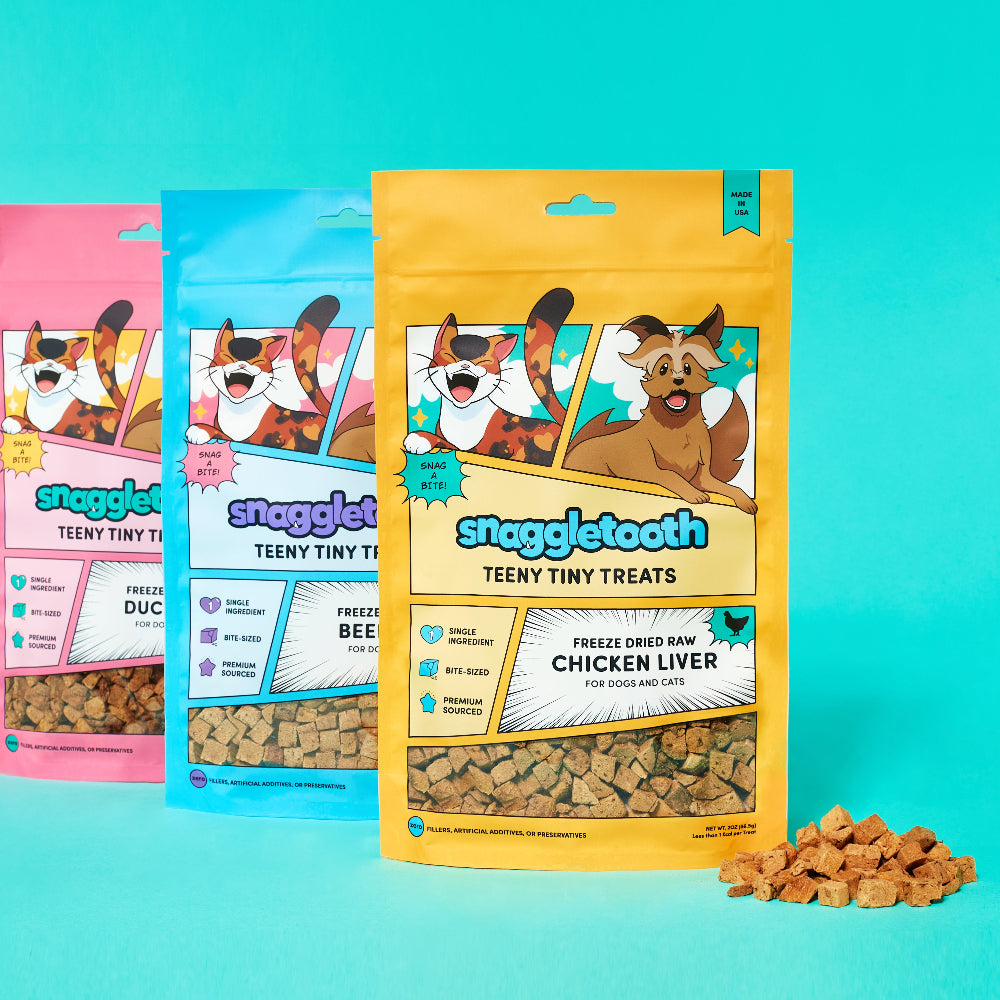 Up Dog X Snaggletooth Special Collab Bundle - Three packages of Snaggletooth dog treats on a turquoise background